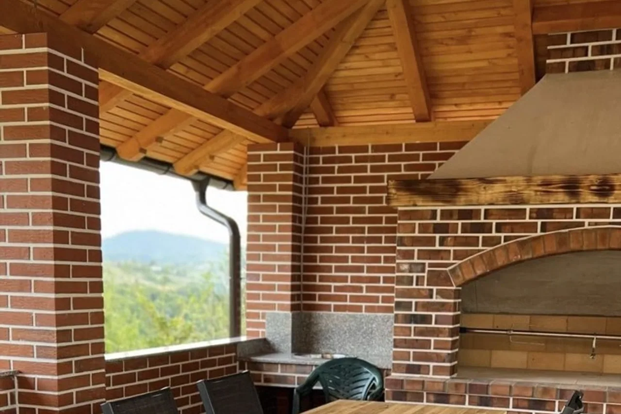 Solid wood restaurant interior with tables and wall cladding